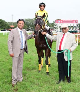 Echoes Of Time (A Ashhad Asbar up) winner of the MAJ. P.K.MEHRA MEMORIAL SUPER MILE CUP (GR.1), being led in by trainer Aravind G on Sunday races at Mysore.